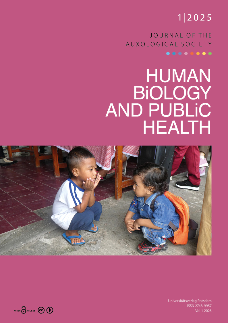 Two squatting children from Indonesia