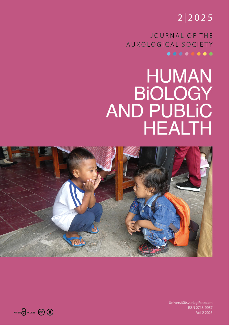 Two small Indonesian children sit squatting opposite each other and talk.