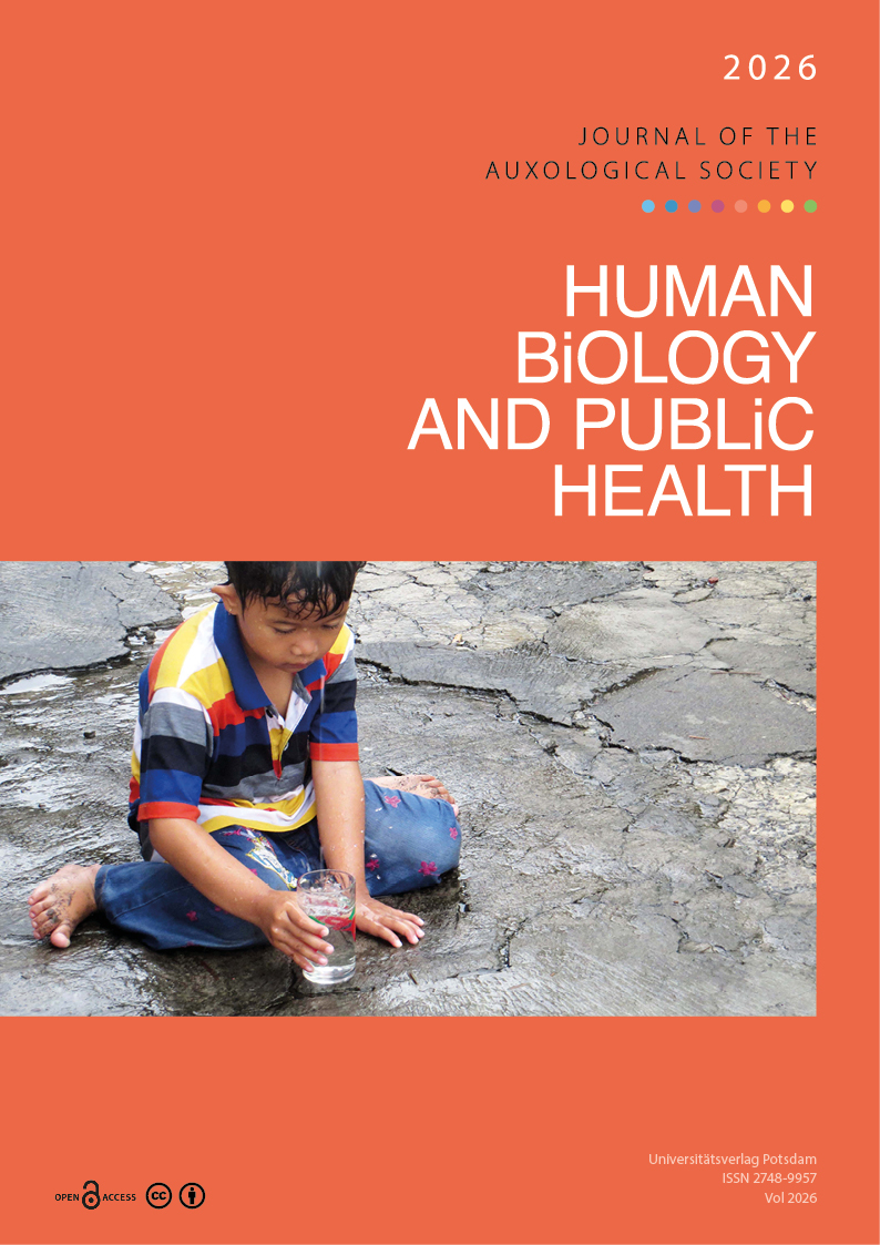 A dreaming boy is sitting in the rain and collects water in a glass